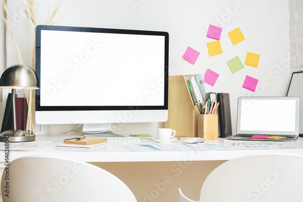 Fototapeta Wokrplace with empty white gadgets