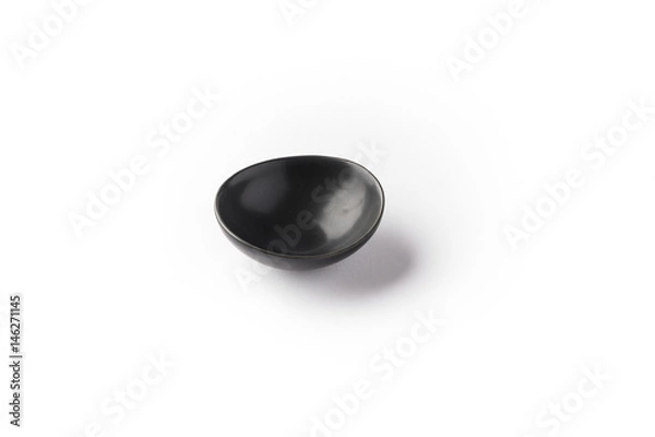 Fototapeta Mini black bowl for serving sauces, spices, and condiments