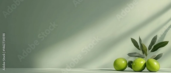 Obraz Green fruits with leaves on light green background minimalist still life photography