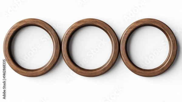 Obraz Three round, wooden picture frames, shown from the front, against a white background.
