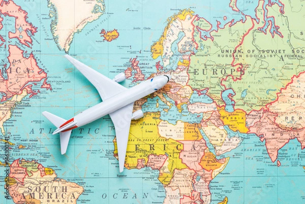 Fototapeta Travel. Trip. Vacation - Top view airplane with touristic map