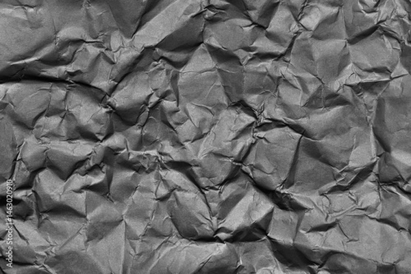 Obraz A textured gray crumpled paper background with natural creases and folds. Ideal for design projects, digital graphics, or creative presentations requiring a vibrant.