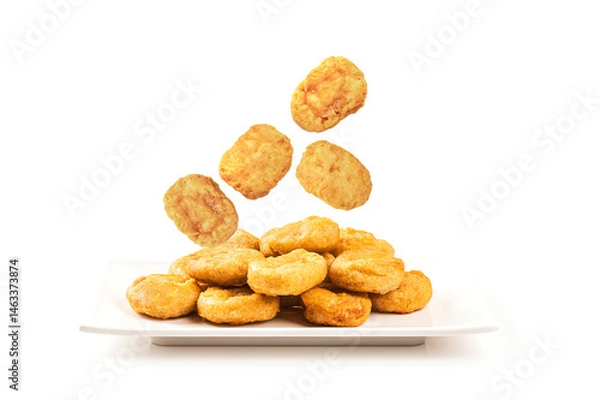 Fototapeta Chicken nuggets on ceramic plate isolated on white background.