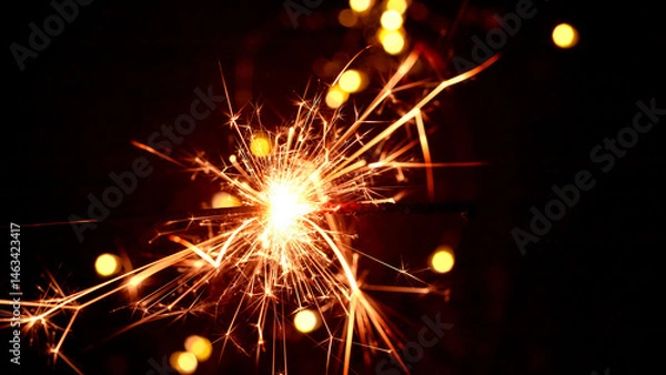 Obraz Happy New Year and Merry Christmas, Glittering burning sparkler against blurred bokeh light background