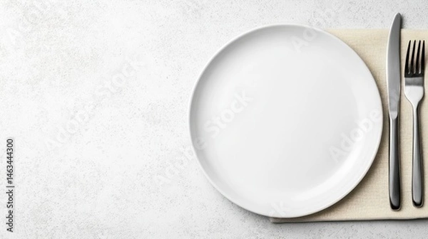 Obraz Empty white plate with cutlery on placemat overhead view