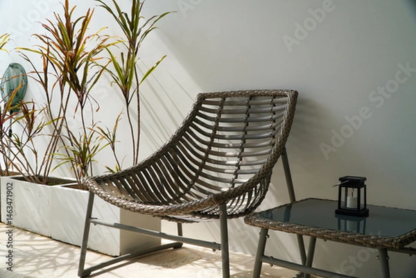 Obraz rattan chair on white wall background, interior design concept.