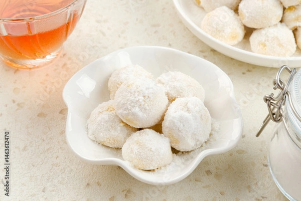 Fototapeta Kue Putri Salju or Snow White Cookies with round shaped. Made from flour, sugar and butter coated with powdered sugar. 