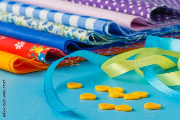 Fototapeta ribbon and scissors on blue background