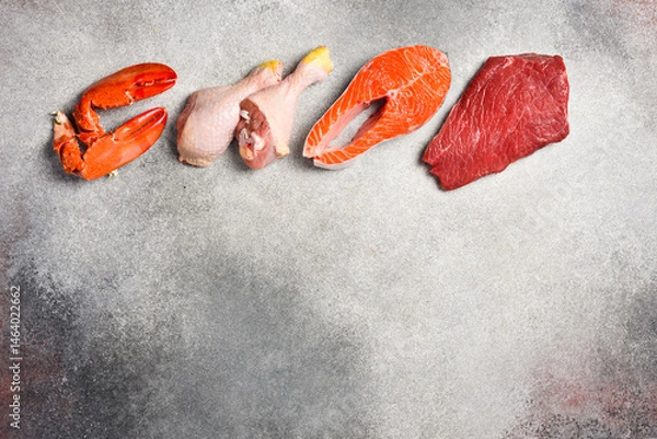 Obraz Set of various raw meats on a dark grunge background. beef, fish, lobster claws, pork and chicken. Free space for text. On a gray stone background.