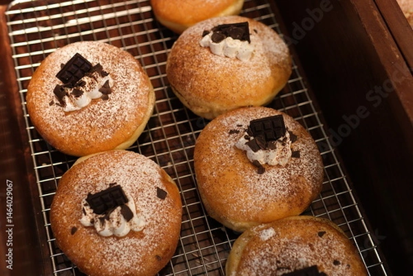 Obraz dark chocolate pieces decorate Soft and fluffy Berliner. German Doughnut with swiss chocolate cream inside. High quality photo