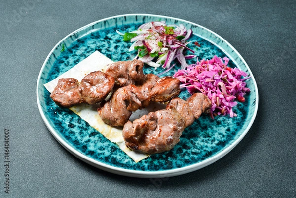Obraz Kebab with vegetables. Grilled lamb shish kebab. Meat dishes.