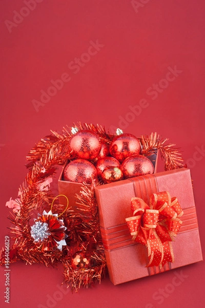 Obraz Red Christmas Gift Box with Ornaments and Tinsel