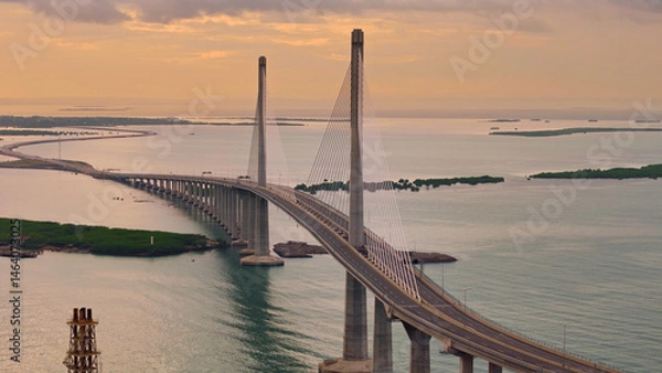 Fototapeta Sunrise over Cebu Cordova Link Expressway, CCLEX. Looking towards Mactan across the Mactan Channel. Aerial Drone Photo.