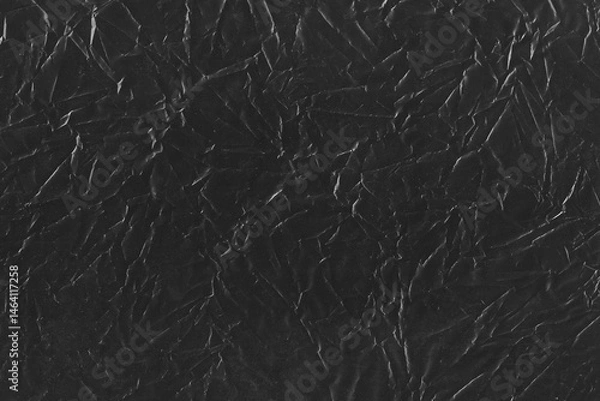 Fototapeta Plastic overlay, distressed, retro texture; grunge background scan for creating nostalgic effect, worn-out, dusty dark scan of crumpled, folded black paper