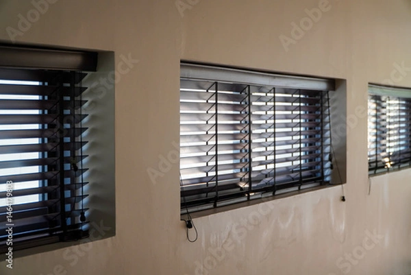 Obraz blinds in the dark. abstract background.this blinds is brown on the yellow background,Blinds on the wall of a hotel room