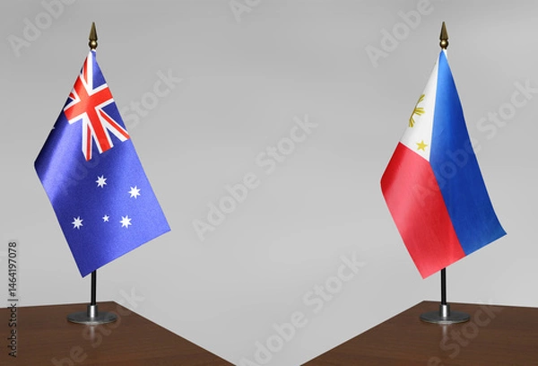 Obraz Table flags of the Philippines and Australia on a gray blurred background