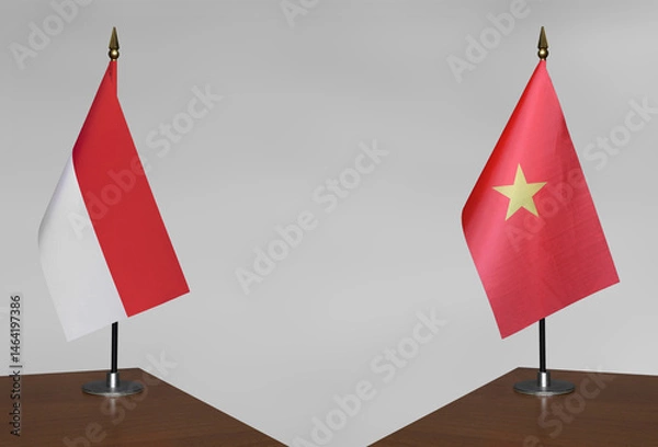 Obraz Tabletop flags of Vietnam and Indonesia on gray blurred background