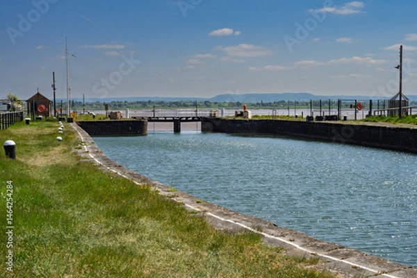 Fototapeta The harbour entrance at Lydney with berthing bollards