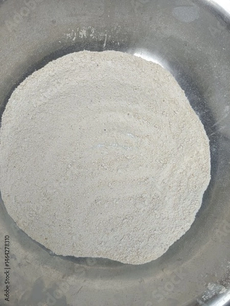 Obraz close-up view of a mound of white flour in a gray bowl