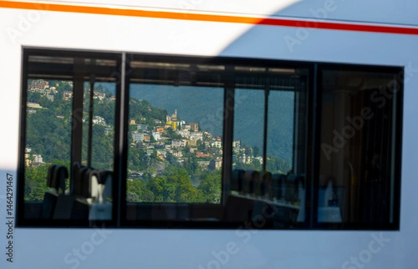 Fototapeta Train Window View over City of Lugano in Castagnola in a Sunny Summer Day in Ticino, switzerland.