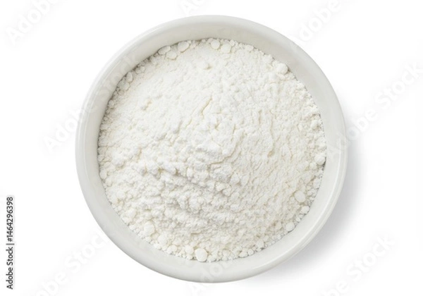 Fototapeta Close-up of white flour in a white bowl, viewed from above on a white background, showcasing its texture