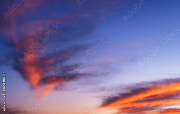 Fototapeta Stunning dramatic sunset sky background with orange purple clouds and pink and red firmament texture