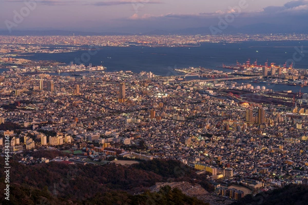 Fototapeta Cityscape of greater Kobe and Osaka area city view from the top of Maya-san in Kobe at twilight time