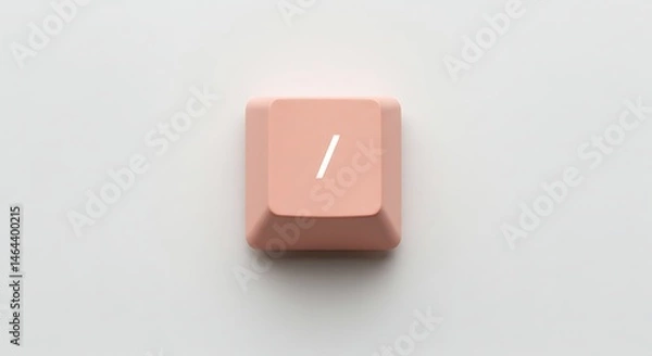 Obraz Close-up of a single peach-colored keyboard key with a slash symbol