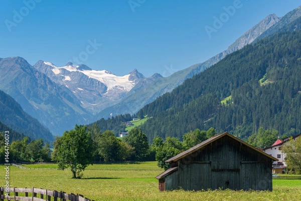 Obraz Scenic alpine summer landscape. View of idyllic mountain scenery in the Alps with wooden barn and green mountain pastures on a sunny day with clear blue sky, Stubai valley, Tyrol, Austria.