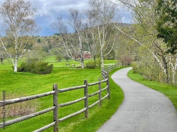 Obraz Walking bike path winds through the green countryside, farms, and mountains of Vermont in this picturesque scene