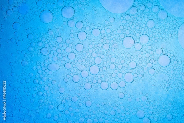 Obraz Macro blue science experiment bubble texture,A close-up of a blue liquid with bubbles in a petri dish, showcasing a captivating microscopic view. ideal for concepts of science, medicine, research,