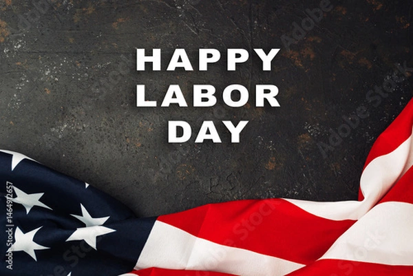 Fototapeta Red and white American flag with the words Happy Labor Day written below it