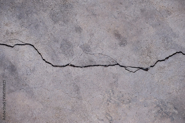 Fototapeta Crack on cement floor texture background. Close-up image.