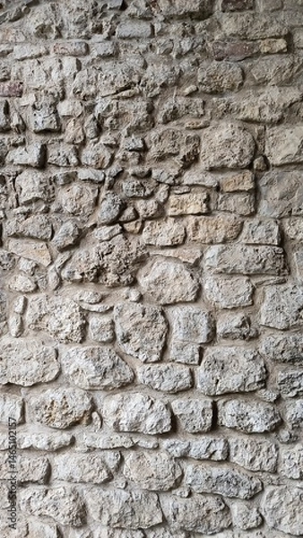 Obraz Rustic stone wall texture with natural colors and weathered appearance