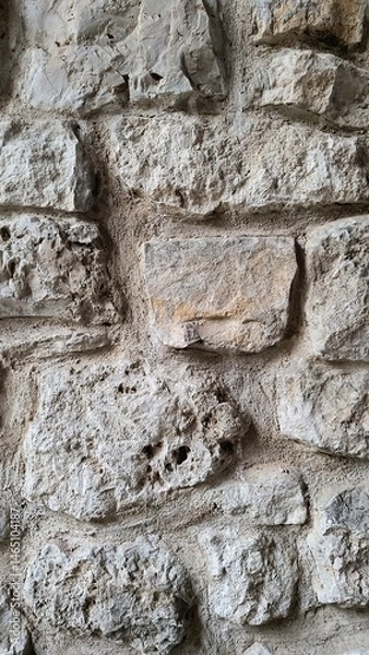 Obraz Textured stone wall in an old building showcases historical craftsmanship and durability