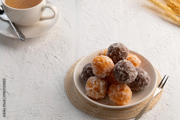 Fototapeta Kanom Kai Hong, a kind of Thai dessert made from rice flour Stuffed with Mung Bean and coated with sugar.Thai snack food (Swan Eggs Dessert)