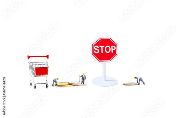 Fototapeta miniature worker with stop sign and shopping cart isolated on white background.