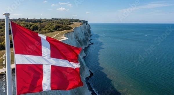 Fototapeta Waving Danish Flag (Dannebrog) Symbolizing Nordic History Against the White Chalk Cliffs of Møns Klint
