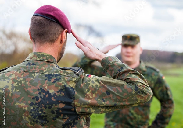 Fototapeta two german soldiers salute each other