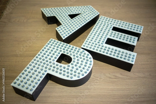 Obraz Three-dimensional LED letters with open diodes.Production of text for outdoor advertising.