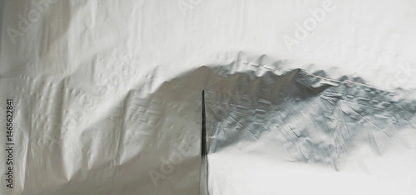Fototapeta Use scissors to cut the foil