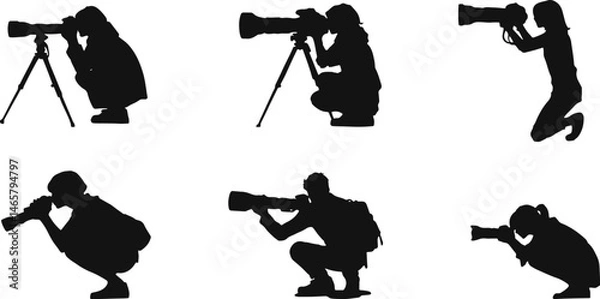 Fototapeta Silhouettes of photographers in various poses with professional cameras and tripods