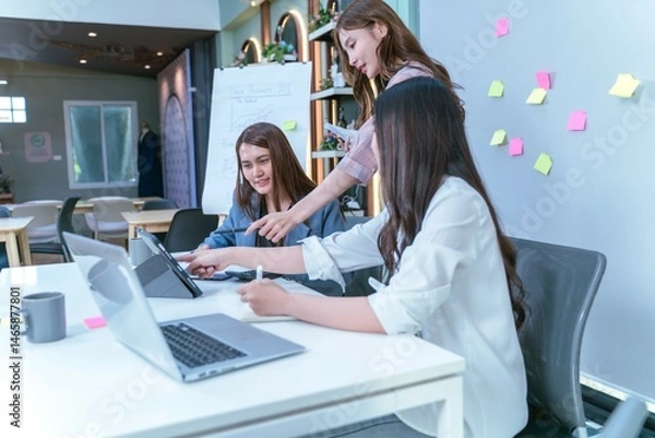 Obraz Creative Team of Women Collaborating with Technology in Modern Office.