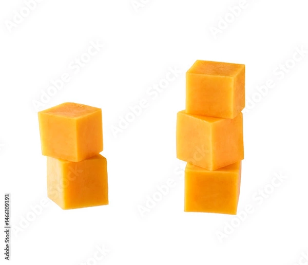 Fototapeta cheddar cheese sliced ​​into cubes isolated on white background.