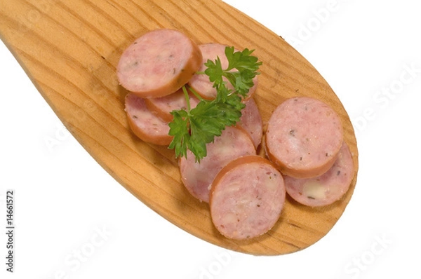 Fototapeta Wurstscheiben auf einem Holzlöffel