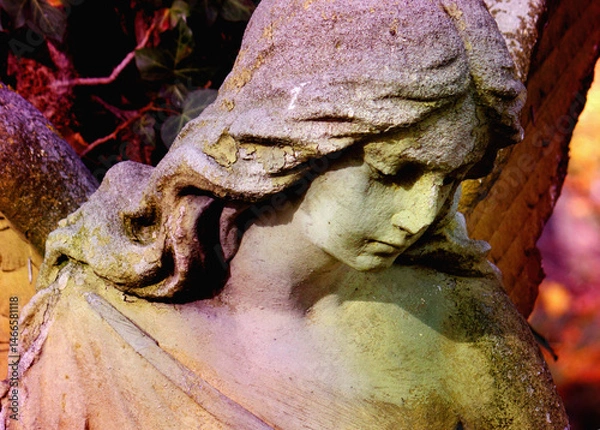 Fototapeta Angel as a symbol of love, kindness, and suffering. Fragment of very ancient statue.