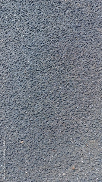 Obraz Close-up view of dark gray sands, showing its coarse texture and granular composition. Ideal for background or overlay.