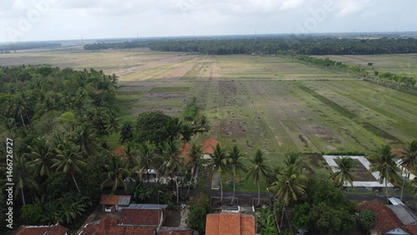 Obraz Aerial view of a village shows a panoramic rural landscape