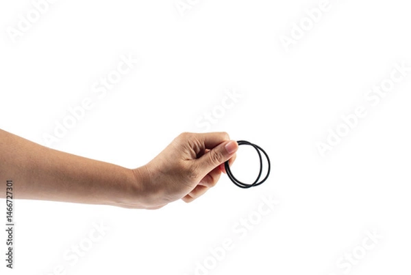 Fototapeta Black rubber band in hand isolated on transparent background