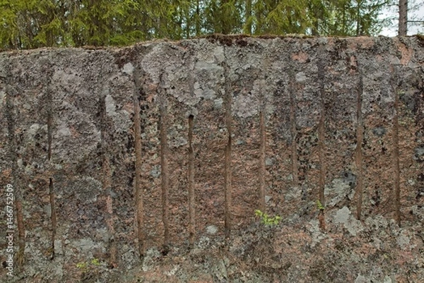 Fototapeta The historical Hevonniemi quarry in Pyterlahti, where red granite was excavated. Traces of excavation are still visible, Pyterlahti, Virolahti, Finland.